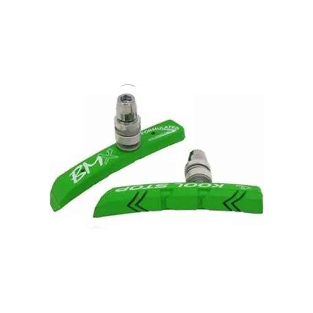 Two Kool Stop BMX brake pads in green, equipped with silver bolts and designed for bicycle brakes, are set against a white background.