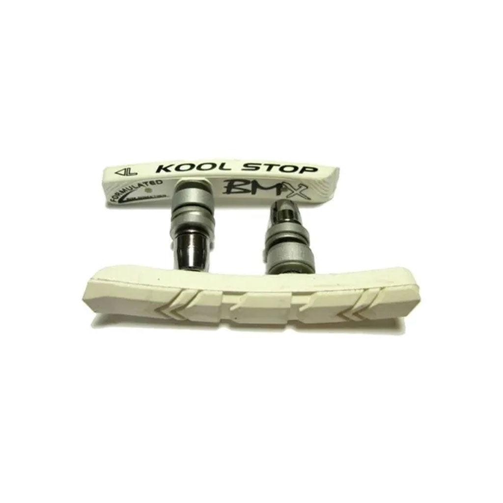 A pair of Kool Stop BMX Brake Pads in white, featuring two metal attachments.