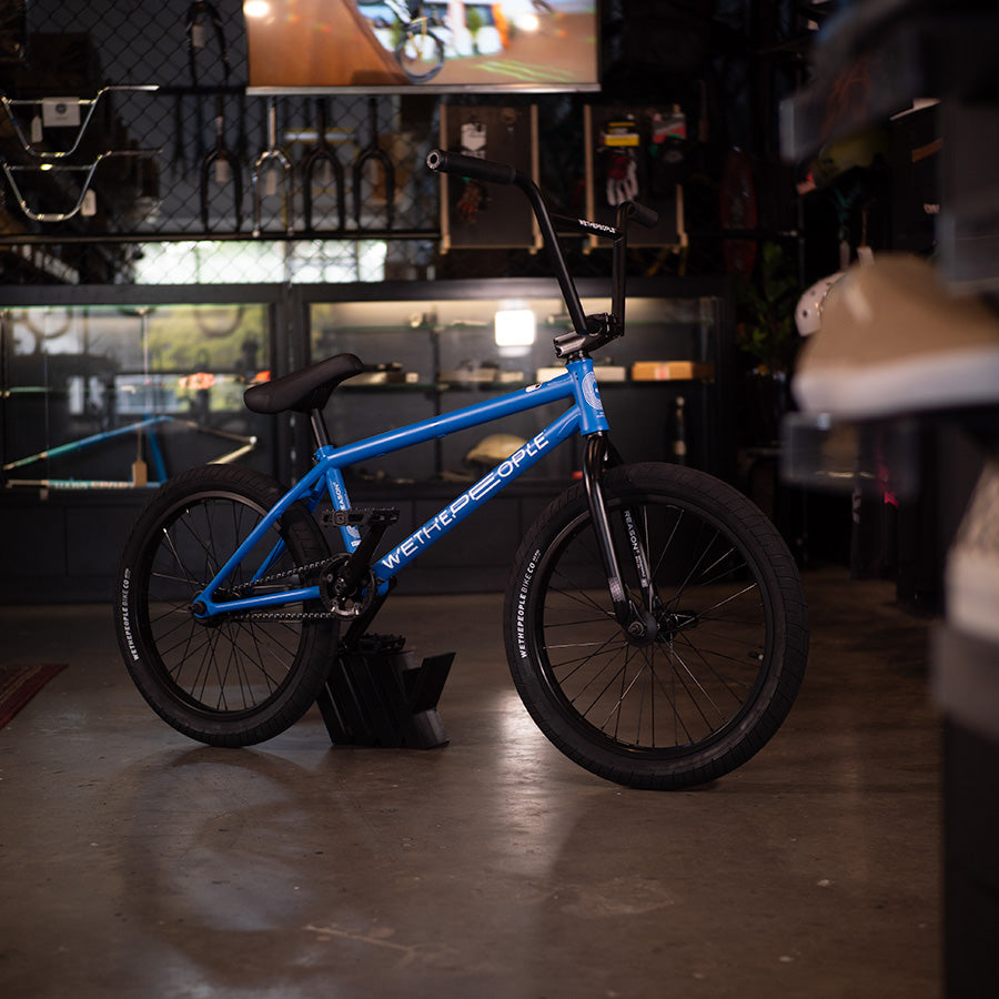 An urban warriors' high-performance ride, the Wethepeople Reason 20 Inch BMX Bike, is parked in a store.