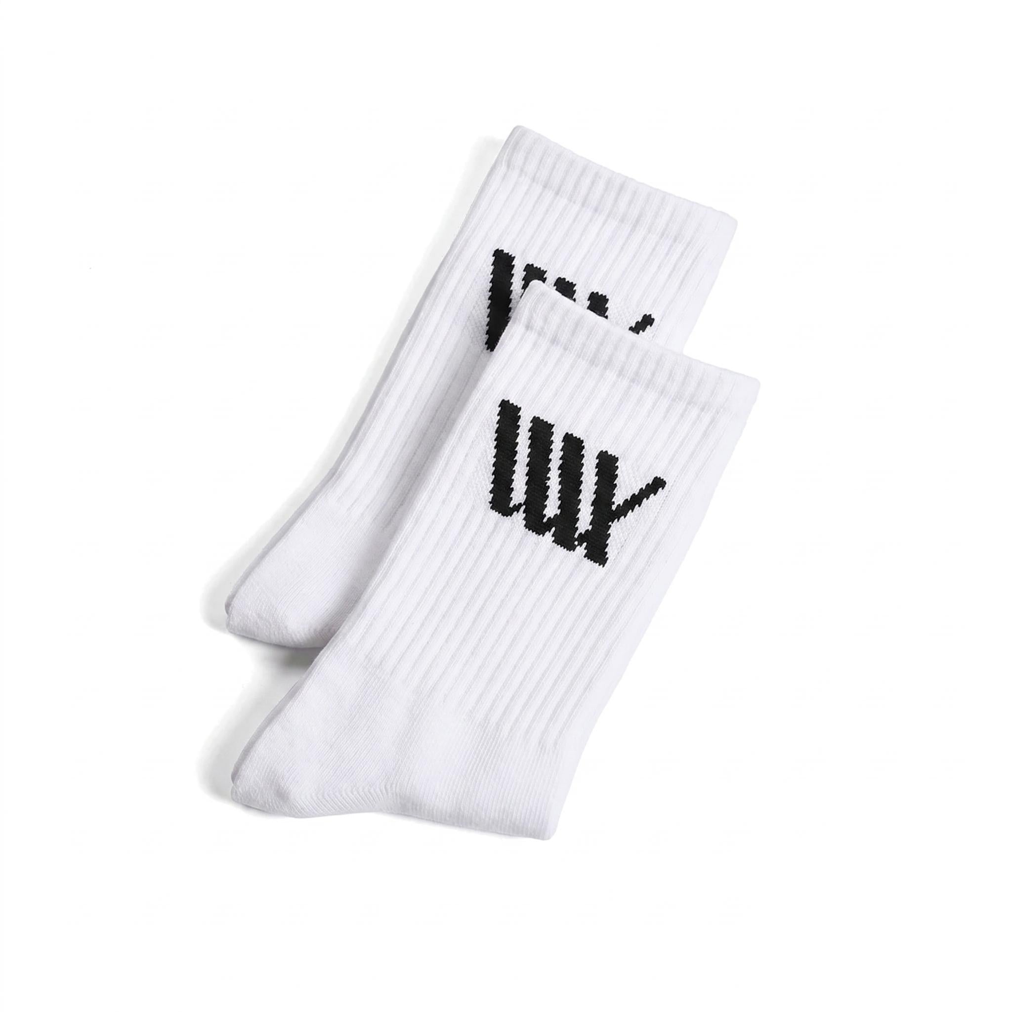 LUXBMX Crew Socks feature a black tally mark on the cuffs, are crafted from a durable bamboo blend, and come in white. Displayed on a white background.