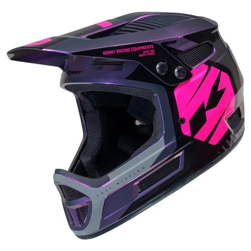 The Kenny Racing Elite Helmet Magic Purple + Glitter & Varnish is a lightweight, full-face motocross helmet featuring a bold black and purple design with pink accents, ventilation panels, and “KENNY RACING EQUIPMENTS” text across the top. Offering standout style and superior protection, this BMX race helmet is an ideal choice for riders needing smaller sizes—including XXXS.