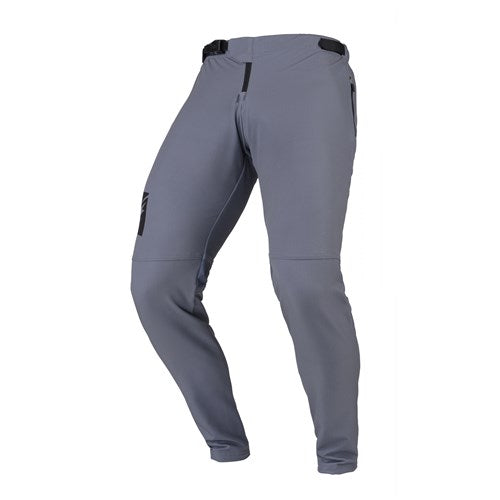 Kenny Racing Prolite Pants in Grey feature an ergonomic cut, adjustable waist, and black thigh accents. They are made from lightweight, multi-directional stretch fabric for maximum comfort and flexibility.