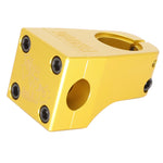 The Fiend Mills Front Load Stem is a gold CNC aluminum BMX stem with black hex bolts and engraved text, designed to connect handlebars to the fork for a retro look.