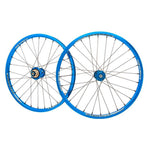 A pair of blue Answer 20 X 1.1/8 Pinnacle Wheel Set on a white background.