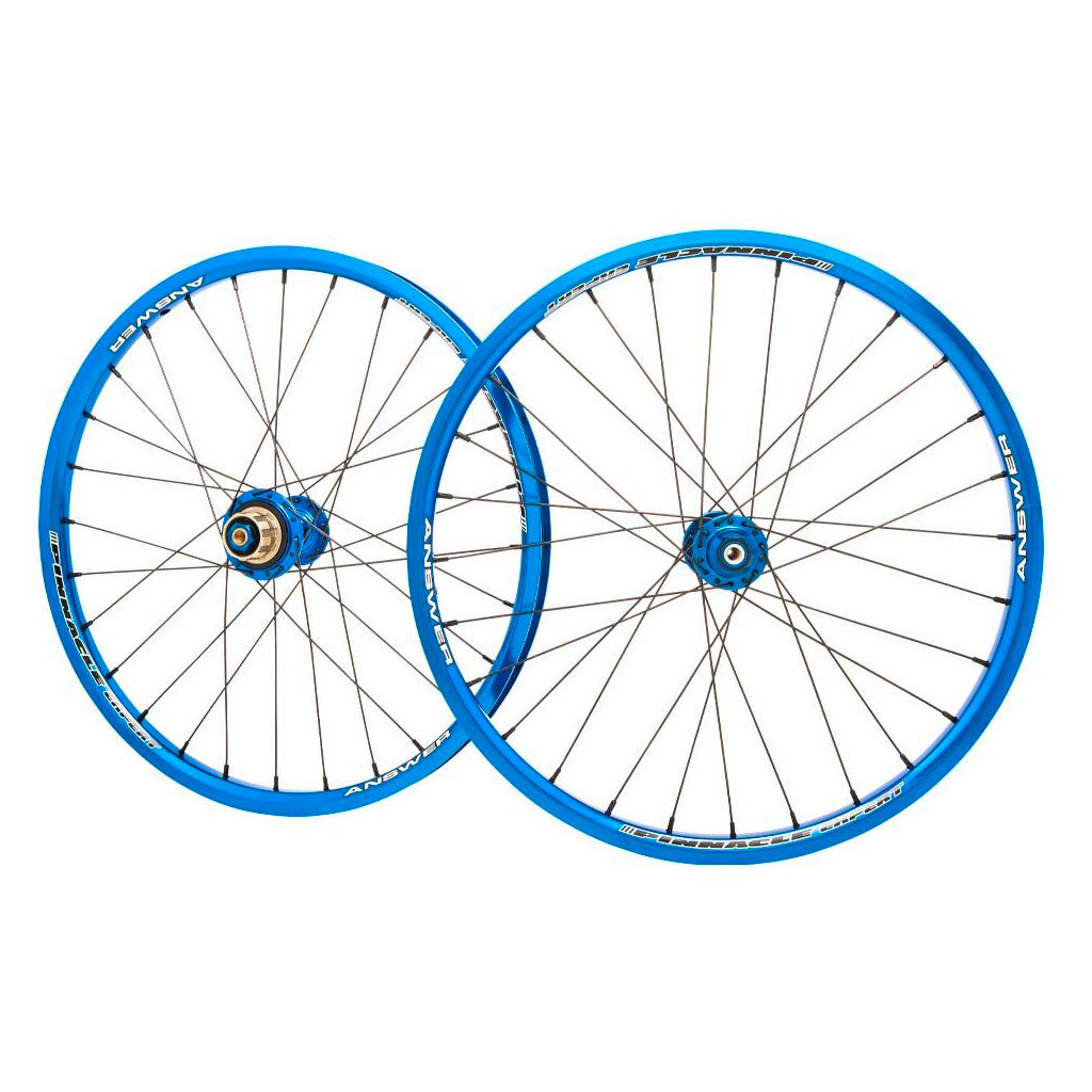 A pair of blue Answer 20 X 1.1/8 Pinnacle Wheel Set on a white background.