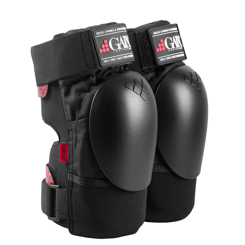 A pair of Gain The Shield Hard Shell Knee Pads designed for shock absorption during freestyle riding on a white background.