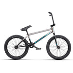 A Wethepeople Justice 20 Inch Bike in black and silver with top-of-the-line components, featuring "WeThePeople" branding on the frame, and black handlebars, seat, and tires. Side profile view.