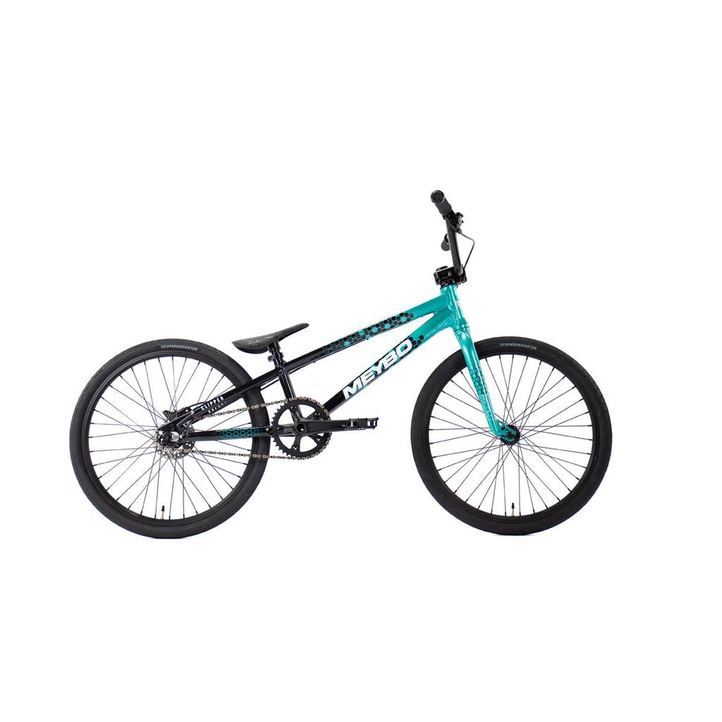 The Meybo 2026 Clipper Expert Bike is a teal and black BMX race bike with a "Meybo" logo, single gear, flat seat, and black tires—ideal as an entry-level race bike.