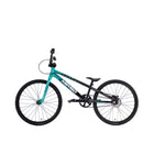 Side view of the Meybo 2026 Clipper Junior Bike in teal and black, with a lightweight frame, flat pedals, and thin tires, displayed against a plain white background.