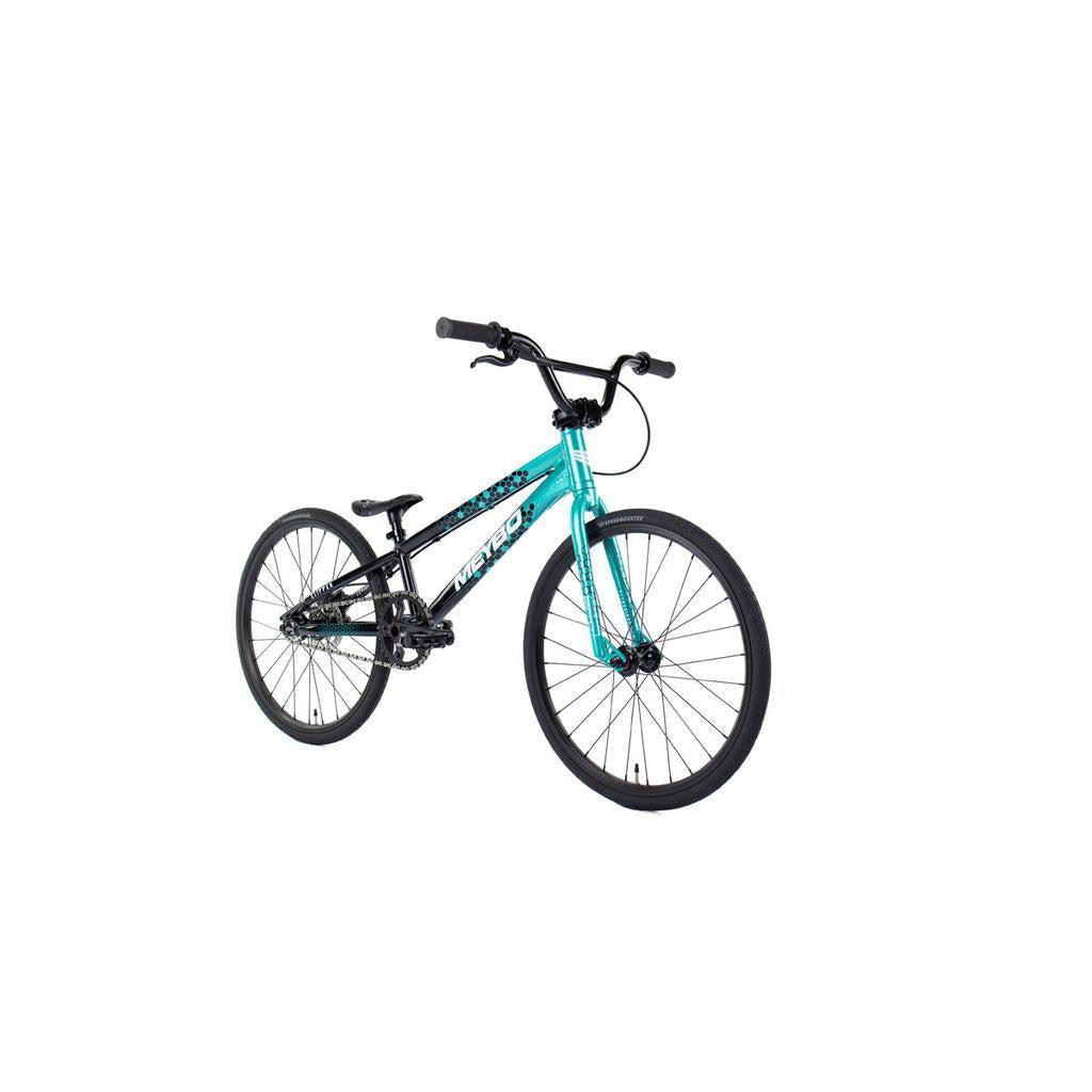The Meybo 2026 Clipper Junior Bike is shown on a white background, featuring a lightweight teal and black frame, straight handlebars, and thin tires—ideal for entry-level riders.