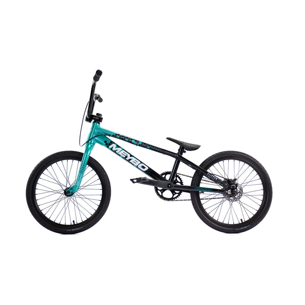 The Meybo 2026 Clipper Pro XL Bike is a teal and black BMX race bike with a compact frame, straight handlebars, and knobby tires, shown on a white background.