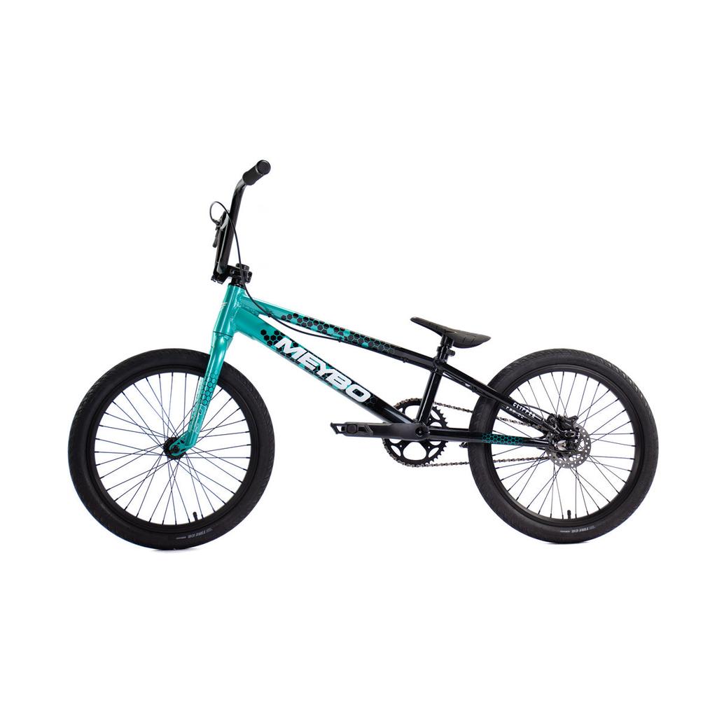 The Meybo 2026 Clipper Pro XXL Bike features a teal and black sloped frame, thick tires, and raised handlebars—an excellent entry-level BMX race bike, pictured in profile against a white background.