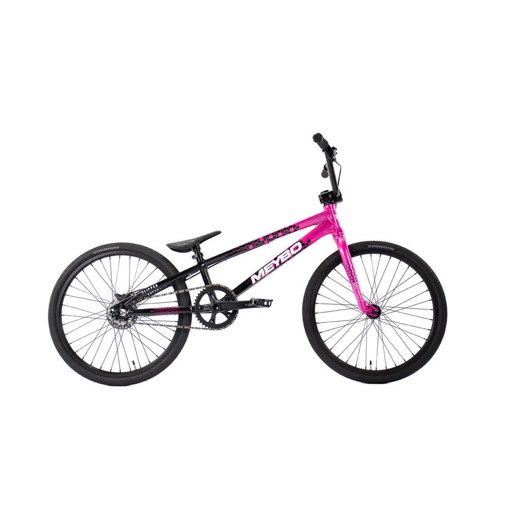The Meybo 2026 Clipper Expert XL Bike is a black and pink BMX race bike with black tires, straight handlebars, and a single gear, shown on a white background—ideal as an entry-level race bike for new riders.