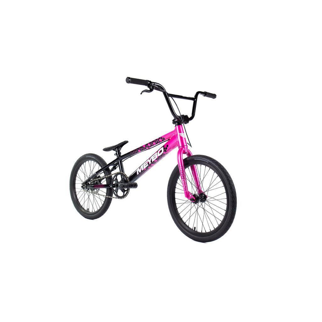 The Meybo 2026 Clipper Pro XL Bike, featuring a pink and black design, thick tires, compact seat, and sturdy frame, is photographed on a white background. An ideal entry-level BMX race bike for beginners.