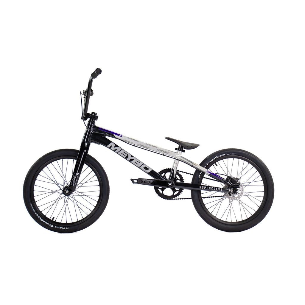 Side view of a black and silver Meybo 2026 Superclass Pro XXL Bike with a 22” top tube, 20-inch wheels, straight handlebars, and padded seat on a white background—perfect for tall BMX racers.