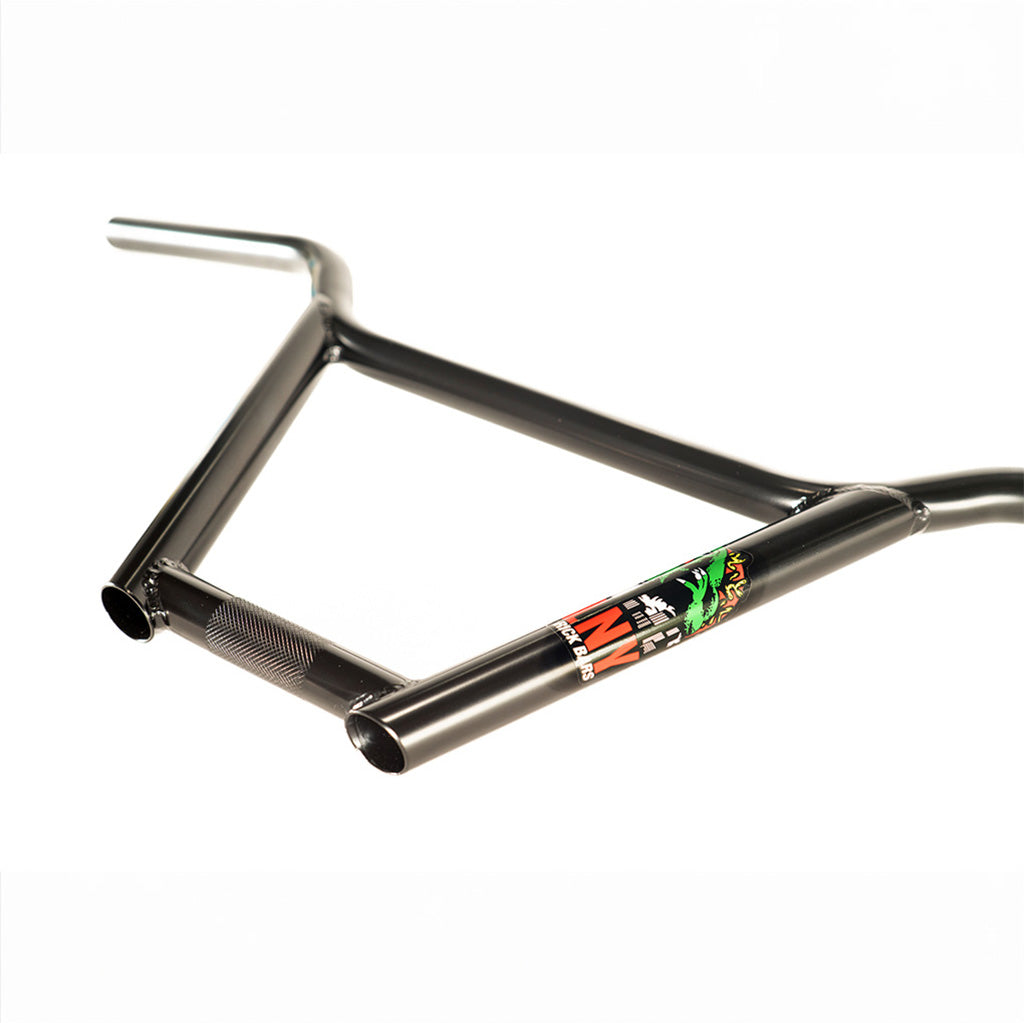 A black bike frame with a green Colony Rick 4pc Bars handlebar.