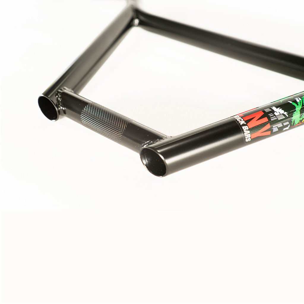 The Colony Rick 4pc Bars offer a sleek black bike frame with a vibrant green logo on it.