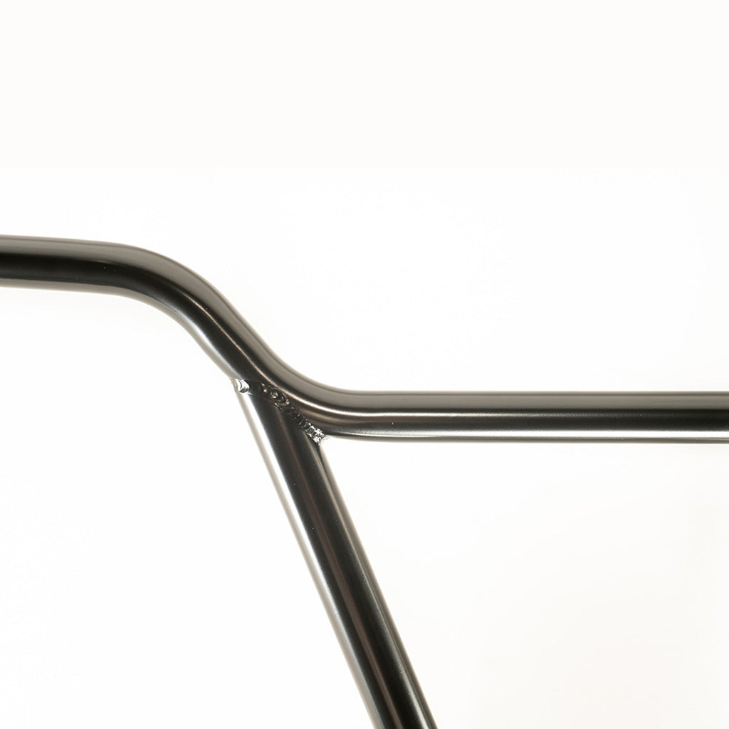 A close up of a Colony Rick 4pc Bars black bicycle handlebar featuring different rise options.