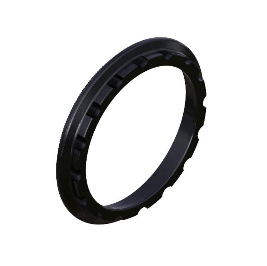 A black, circular Onyx Cassette Lockring with evenly spaced rectangular notches along its inner edge, designed to seamlessly integrate with Ultra SS Hub for an optimized BMX race experience.