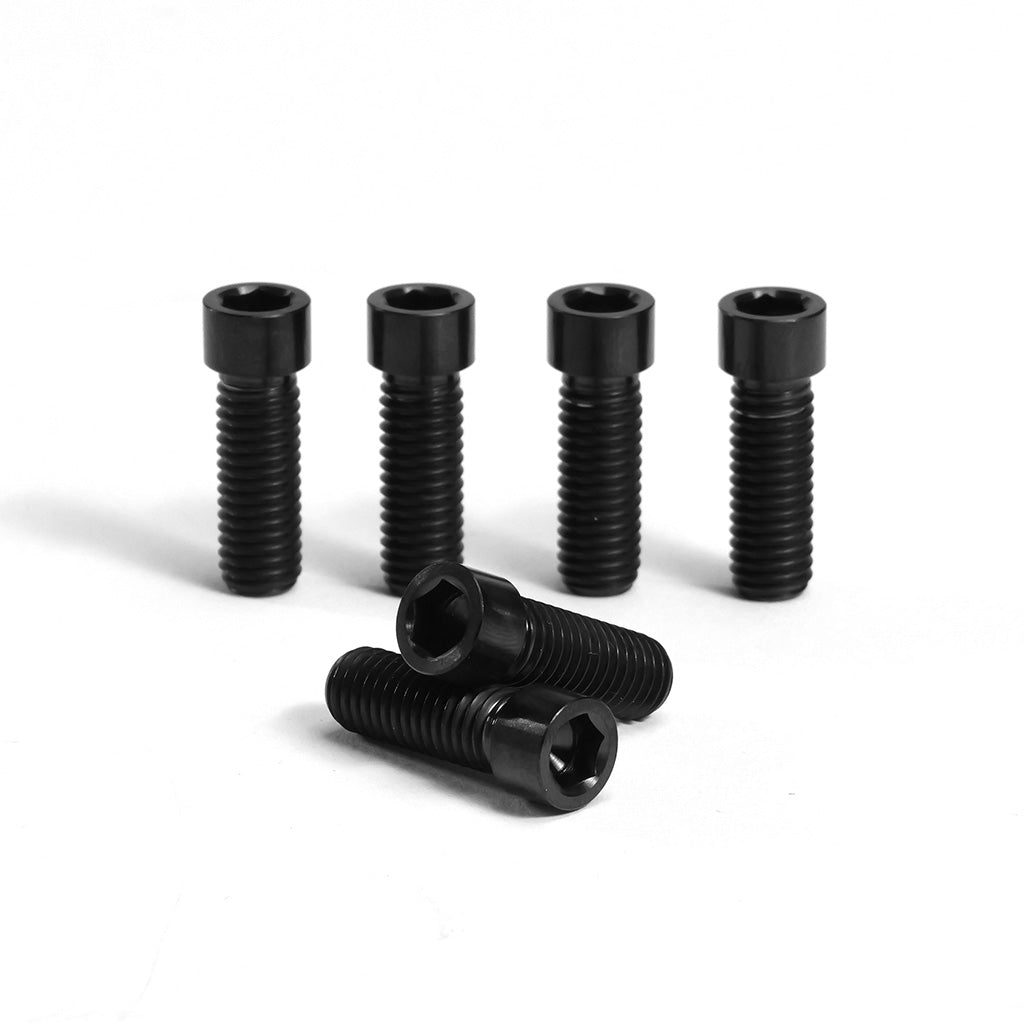 A Titanium M8 Low Profile Stem Bolt (6 Pack), perfect for metric BMX stems, is displayed on a white background—four bolts stand upright at the back, while two lie down in front.