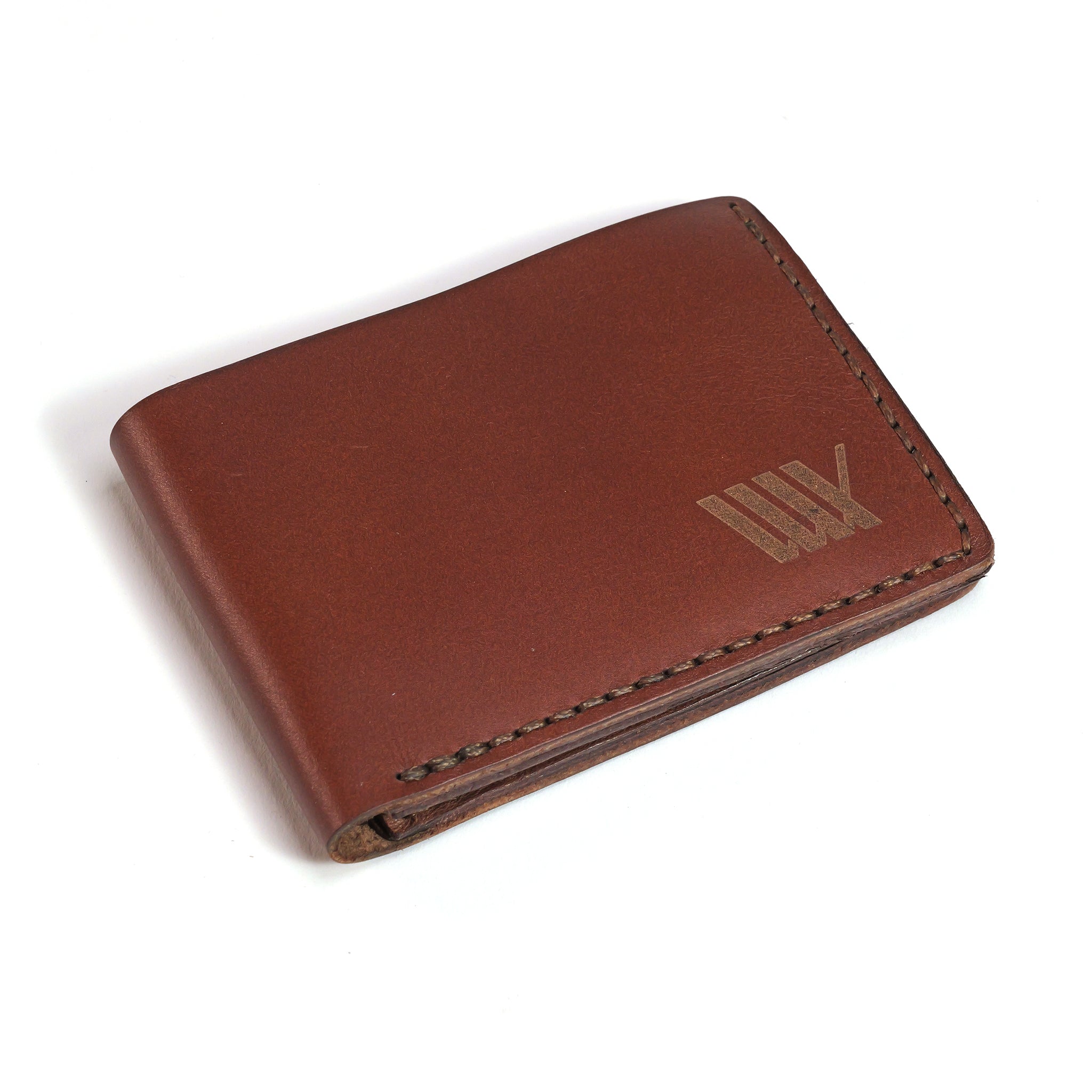 The LUXBMX Bifold Leather Wallet features full-grain brown leather with visible stitching and a subtle embossed logo in the corner, photographed against a white background.