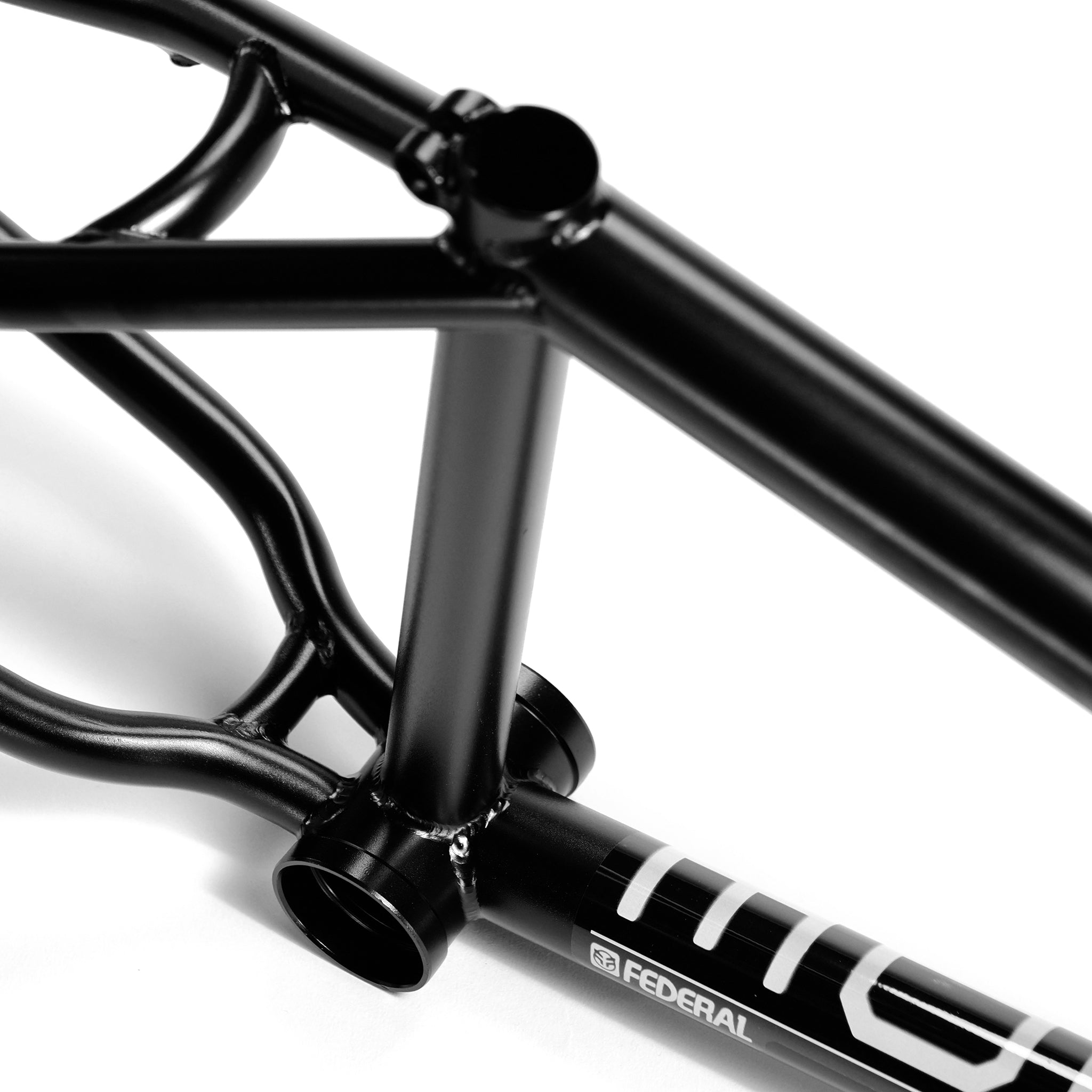 Close-up of the Federal Code Frame, a street BMX frame, highlighting the bottom bracket, seat tube, and part of the chain stays with visible "Federal" branding.