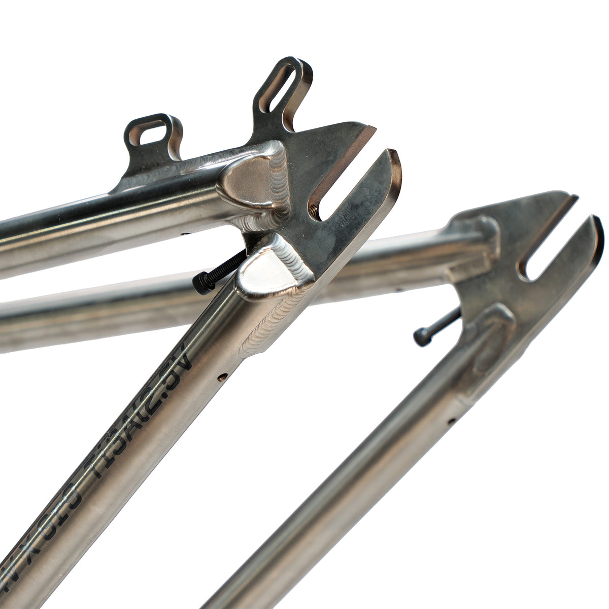 Close-up of the ION BMX Ti22 Titanium 22 Inch Frame’s metal dropouts with slots and mounts, featuring precise welding and a brushed finish—designed to complement its geometry and headtube angle of 74°.