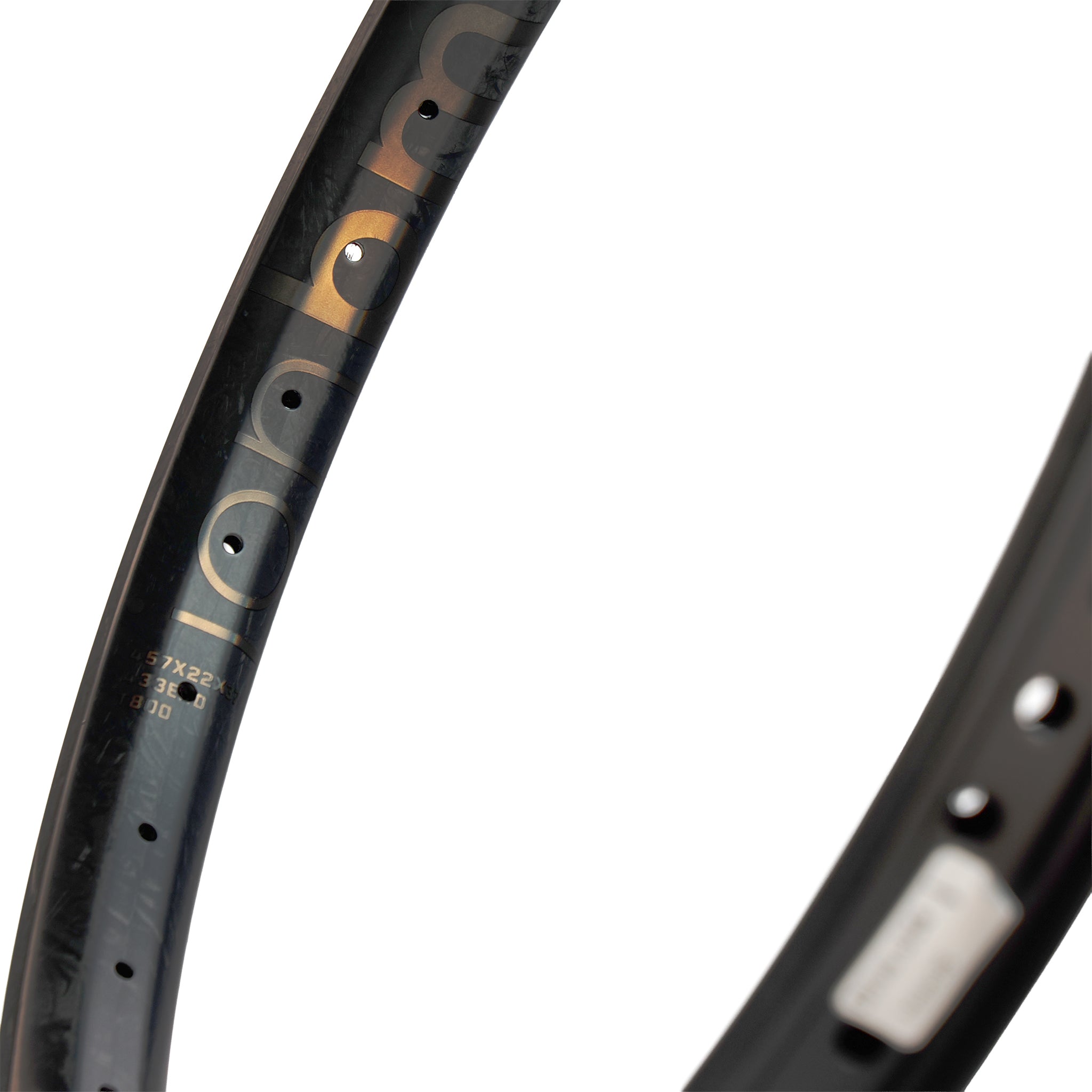 Close-up of the ION BMX C22 Carbon Fiber 22 Inch Braking Rim, featuring branding, size markings, and spoke holes—ideal for riders seeking a lightweight BMX rim.