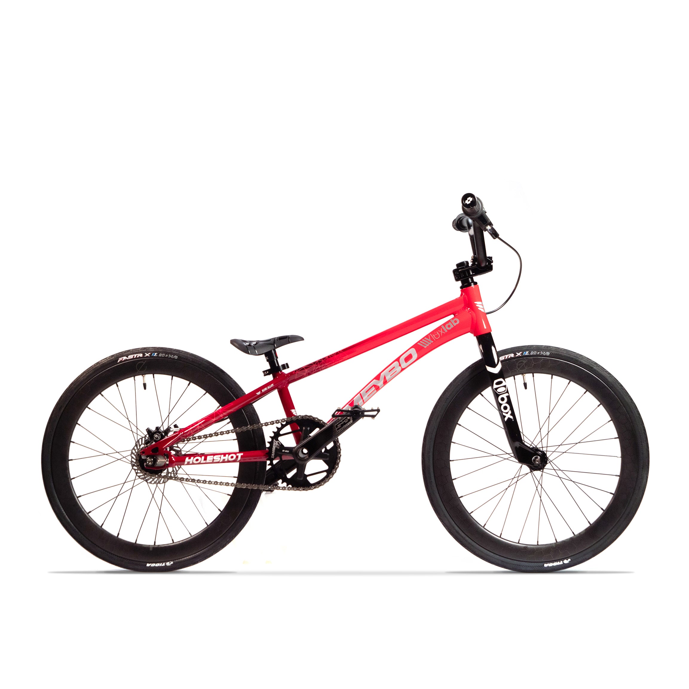 The Meybo Holeshot Junior Custom Bike is a red BMX-style bicycle with black tires, featuring a compact frame, BOX carbon forks, black handlebars, and a Meybo Holeshot Junior seat.