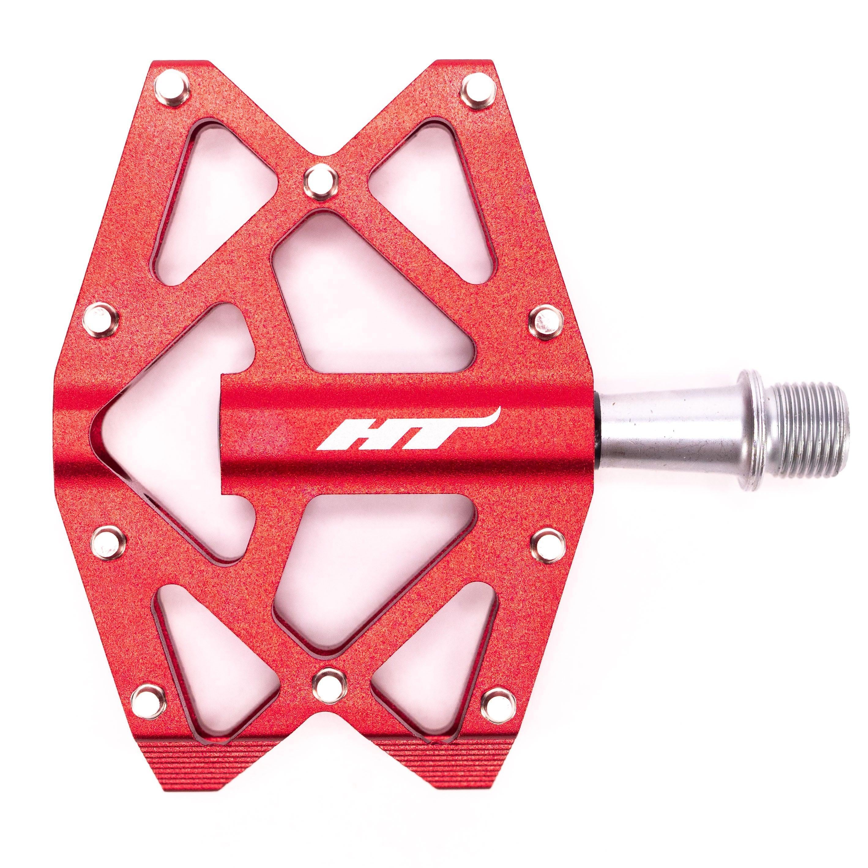 Introducing the HT AXO1A Nano Pedals: red bicycle pedals with a geometric open-frame design and metal axle, crafted for young riders. They boast high-quality DU bushing for smooth, reliable performance.