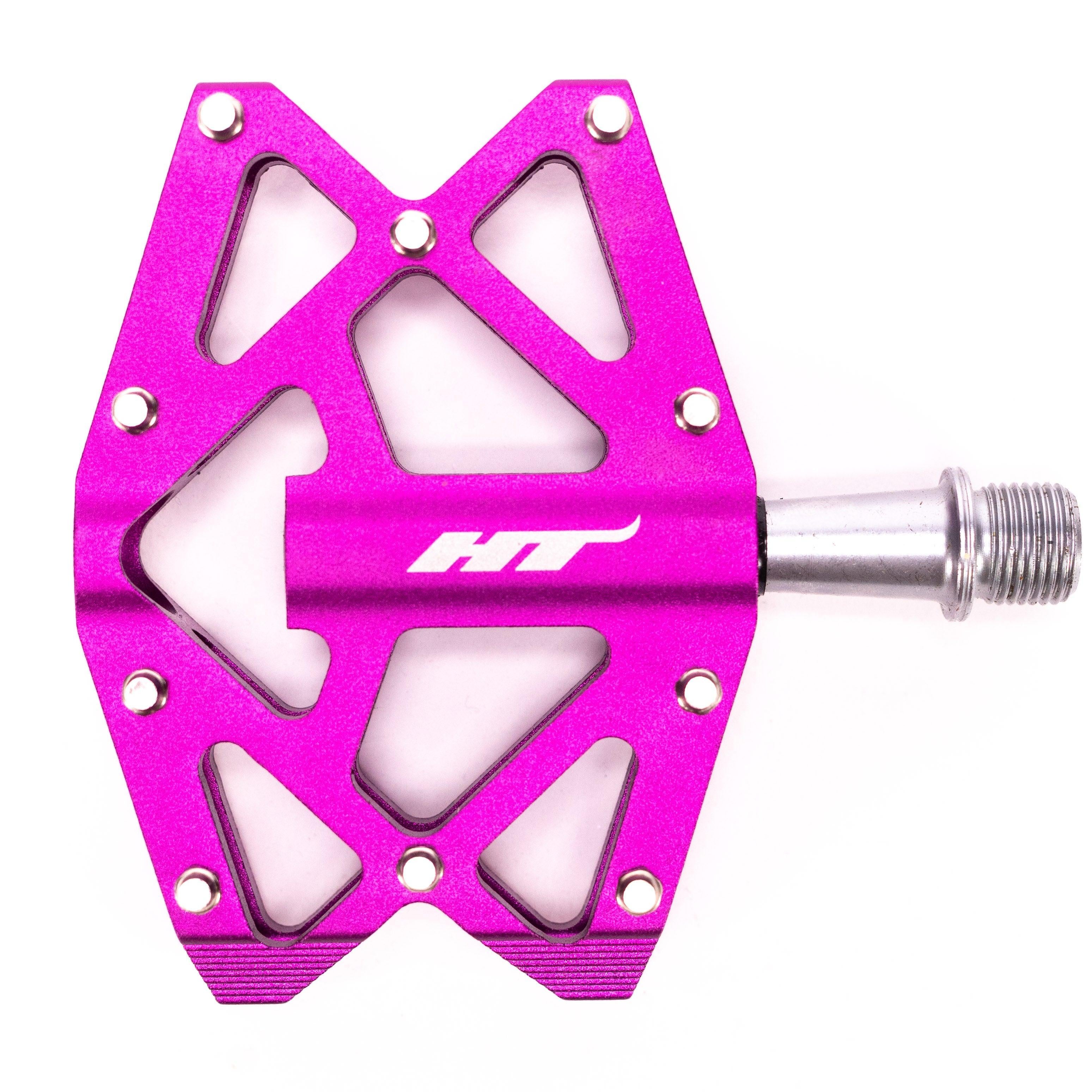 The HT AXO1A Nano Pedals are purple with a metallic axle, geometric cutouts, "HT" printed on them, and designed for young riders. They feature a high-quality DU bushing for smooth rides.