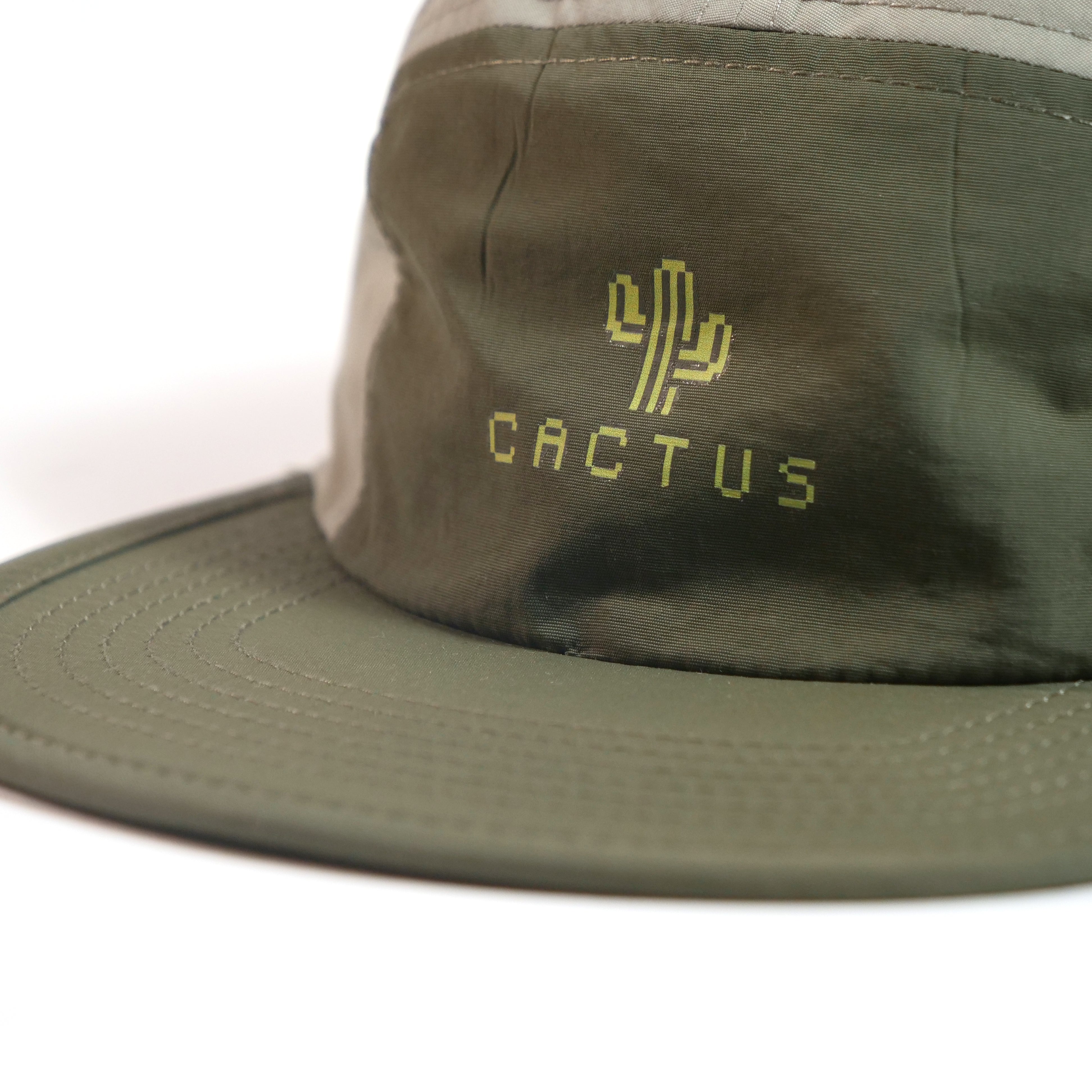 The Cactus BMX Mag 8 Bit Cap Green is an olive green flat-brim hat with a yellow cactus graphic and "CACTUS" on the front—perfect for adding retro flair to your style.