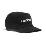 The Cactus BMX Mag Dead Cap Black is a blackout cotton hat featuring a pixel-goth cactus logo and "cactus" embroidered in white pixel-style font on the front.