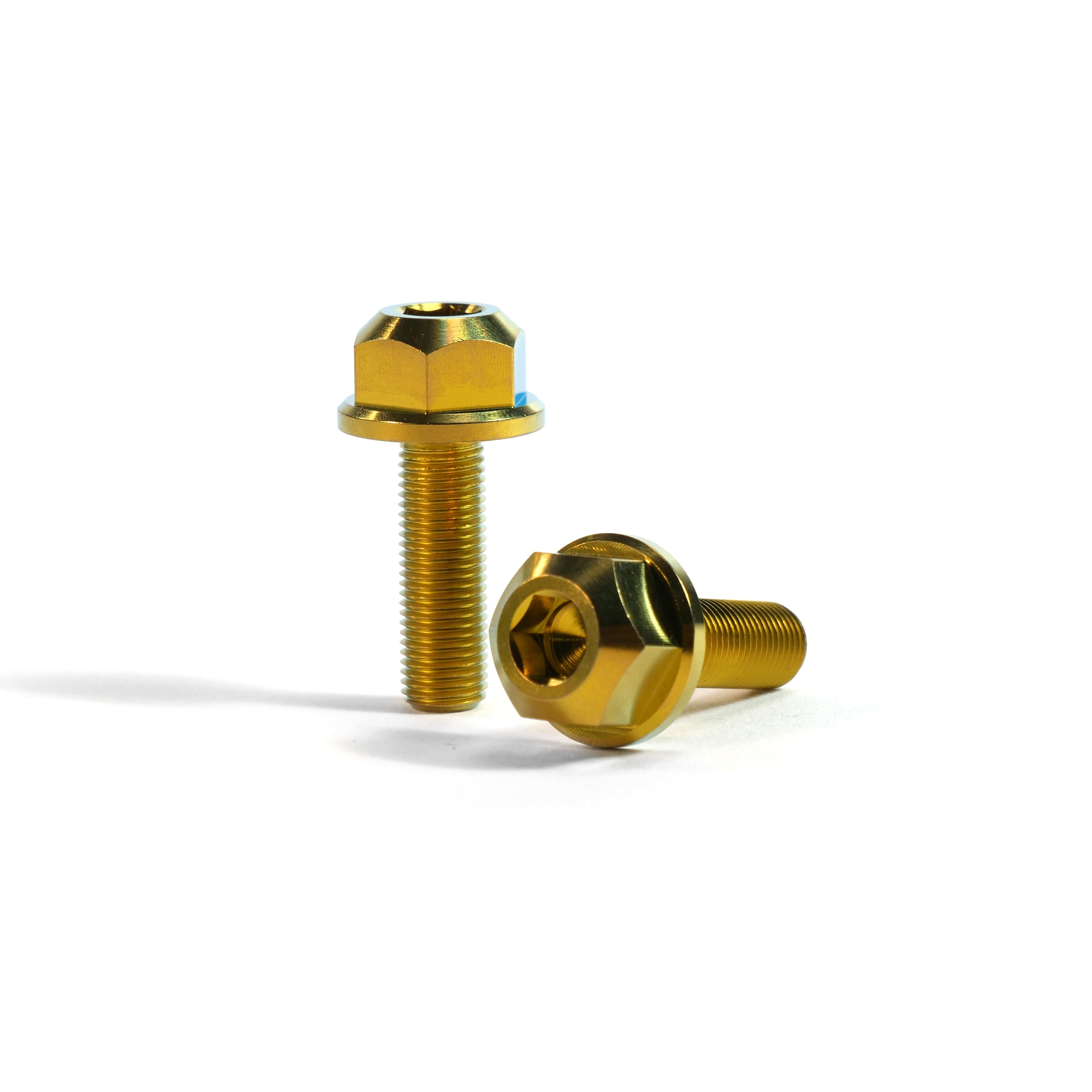 Two ION BMX Titanium GR5 Hex Axle Bolts, precision CNC machined with gold finish and star drive sockets—one upright and one on its side—displayed against a white background.