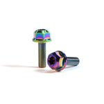 A pair of ION BMX Titanium GR5 Hex Axle Bolts with a rainbow anodized finish are displayed on a white background—one bolt stands upright while the other lies down.