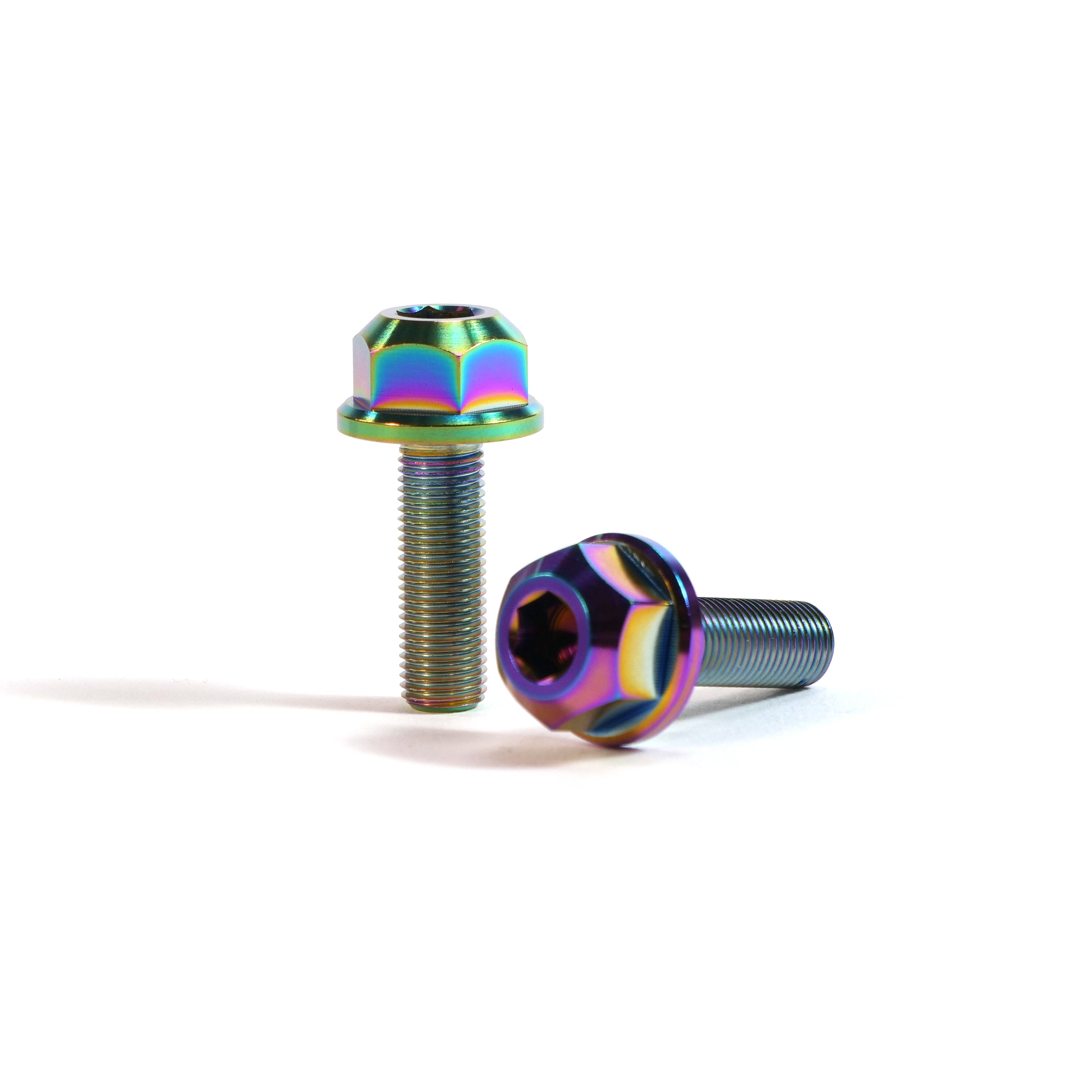 A pair of ION BMX Titanium GR5 Hex Axle Bolts with a rainbow anodized finish are displayed on a white background—one bolt stands upright while the other lies down.