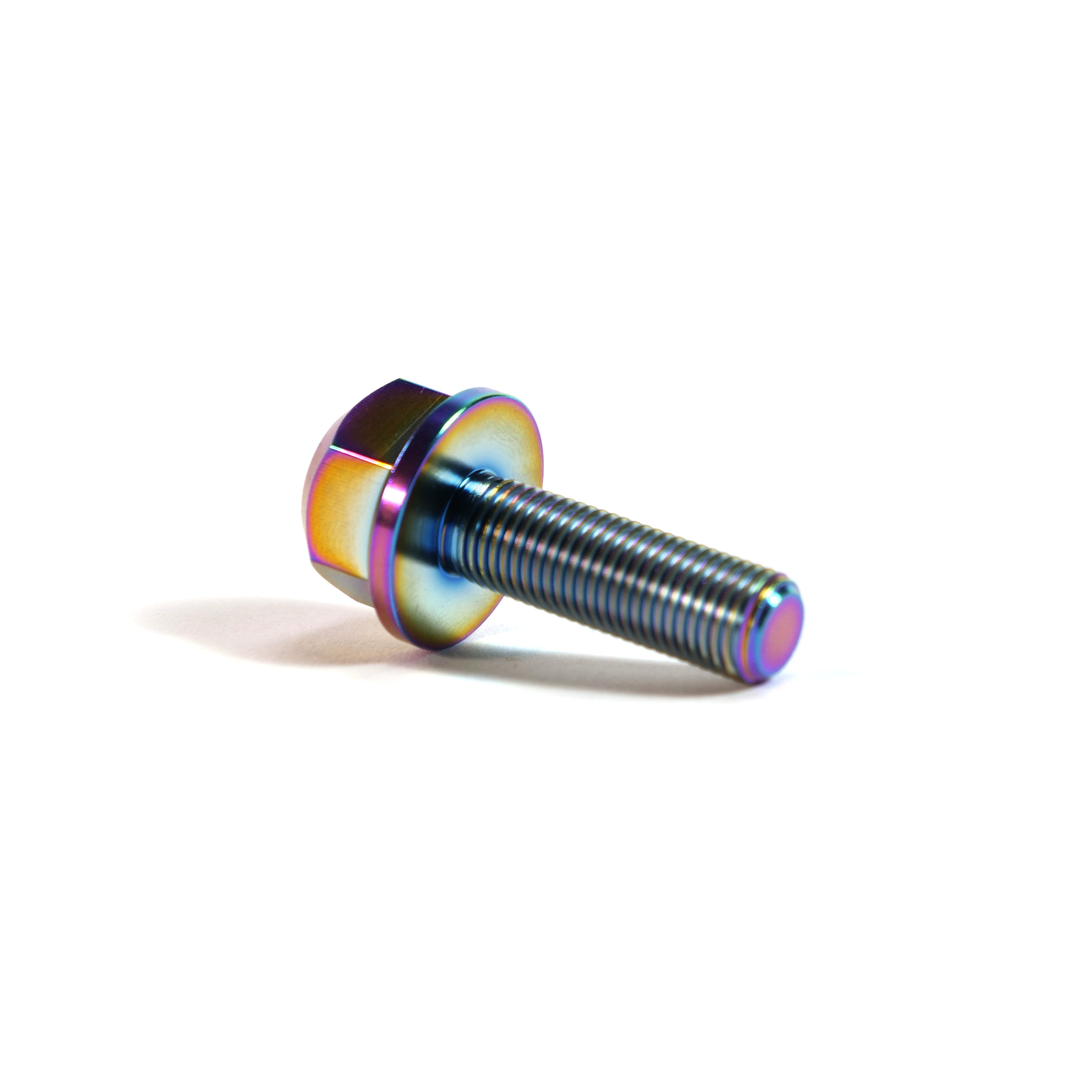 A close-up of the ION BMX Titanium GR5 Hex Axle Bolt, featuring a rainbow iridescent finish, resting on a white surface—ideal as a CNC machined titanium axle bolt for BMX bikes.