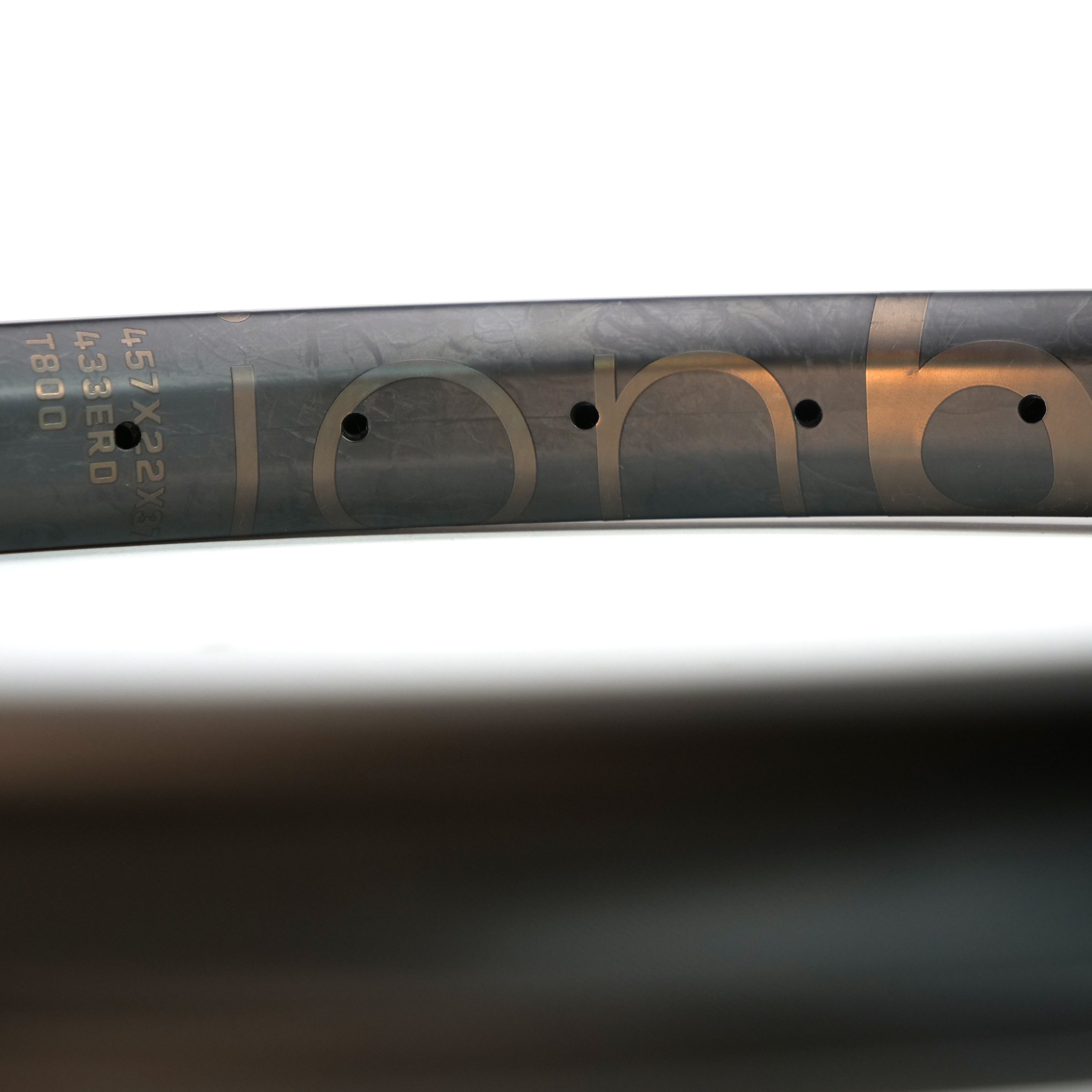 Close-up of the ION BMX C22 Carbon Fiber 22 Inch Brakeless Rim, with "ionb" branding, specs like 457x29, 433 ERD, and T800—demonstrating this rim’s lightweight durability and standout style for BMX riders.
