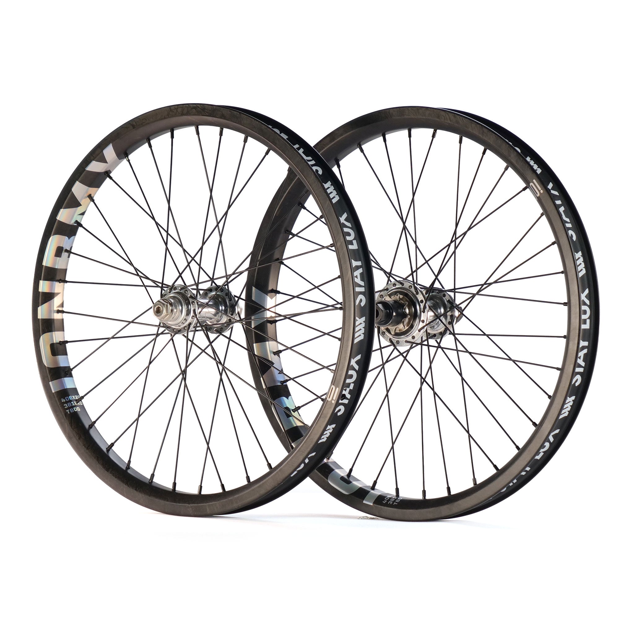 The ION BMX X Tall Order Custom Carbon 20-inch wheelset features two black carbon rims with metal spokes and Tall Order Drone hubs, shown upright and overlapping on a white background.
