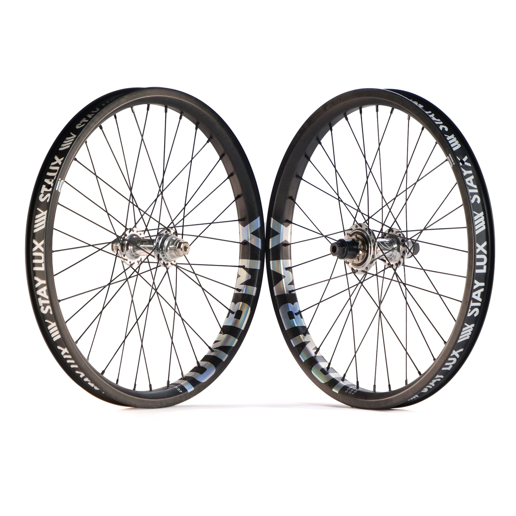 A pair of ION BMX X Tall Order Custom Carbon 20 Inch wheels with spokes and Drone hubs, featuring "STAN'S NOTUBES" and "LUX" rim branding, upright against a white background.