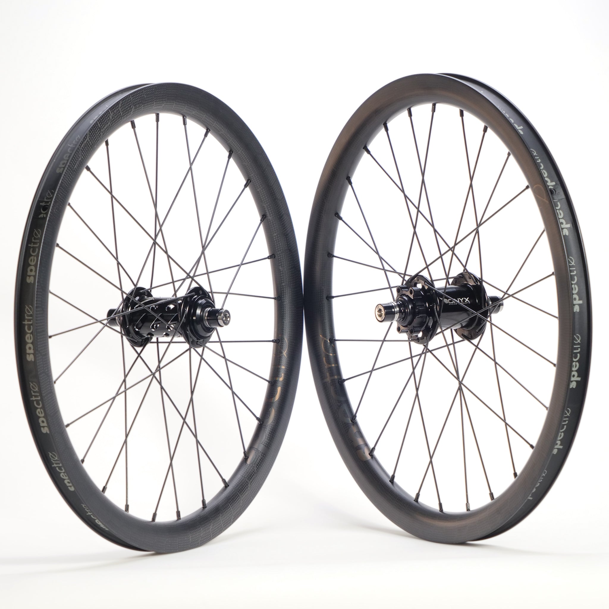 The Spectre X Onyx 451 Disc Wheel Set features deep-section alloy rims and black spokes—an ideal lightweight BMX race wheelset, shown upright on a white background.