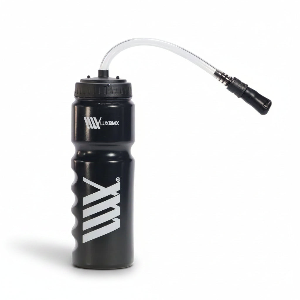 The LUXBMX Race Straw Water Bottle 750ml features a contoured grip, screw-on lid, and flexible straw. Made from BPA-free plastic, this black bottle keeps you hydrated during intense rides.