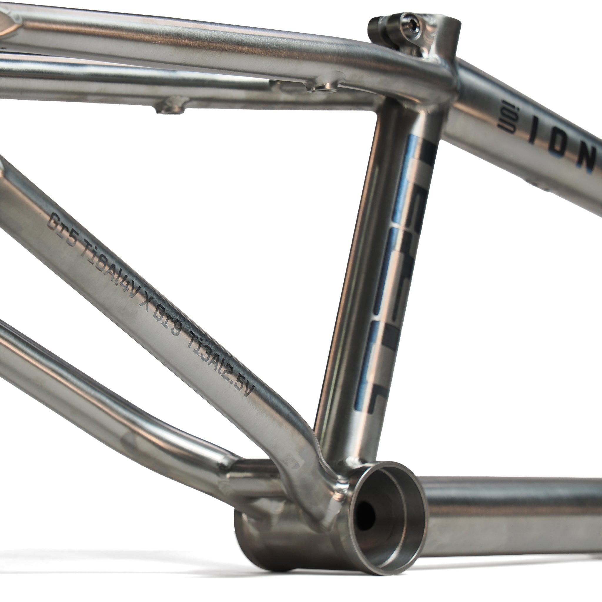 Close-up of the ION BMX AMP20 Titanium 20 Inch Frame, highlighting aerospace-grade titanium welds, tubing, bottom bracket area, as well as visible serial number and logo details.