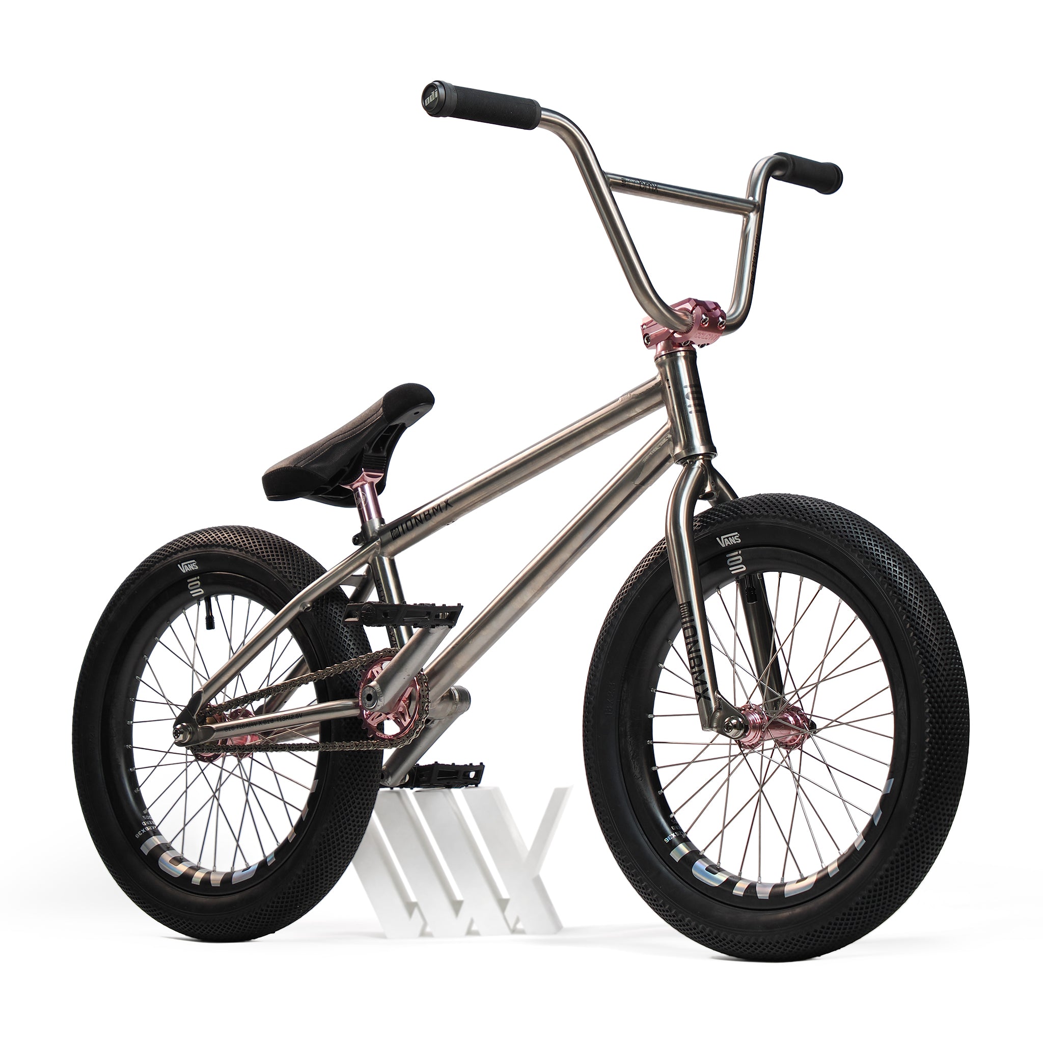 The ION BMX Ti18 Custom Titanium 18 Inch Bike is a lightweight freestyle BMX with sleek black wheels—ideal for riders seeking both style and top performance.