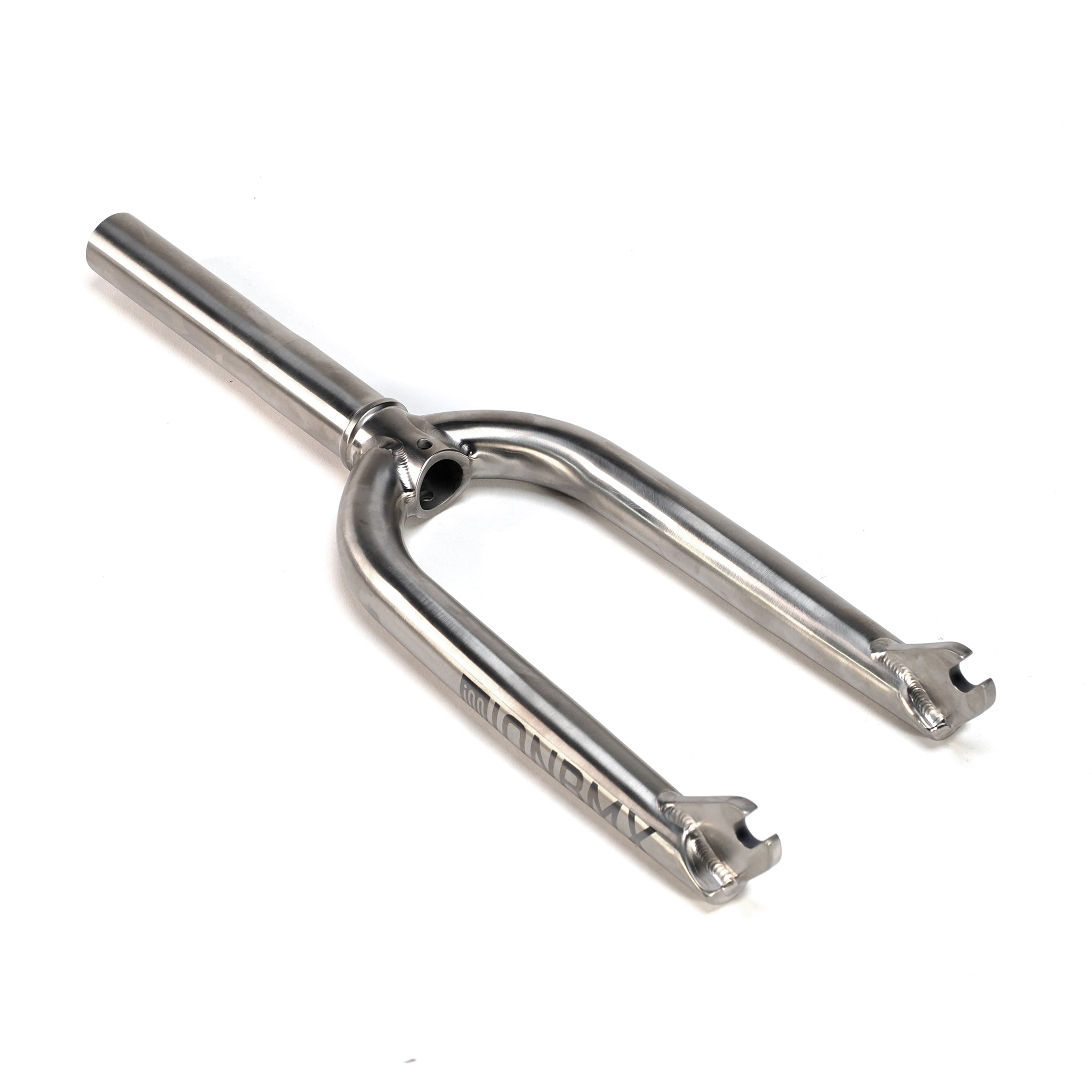 The ION BMX Ti16 Titanium 16 Inch Forks are silver metal forks with two dropouts, a straight steerer tube, and "MONDAY" engraved on the side.