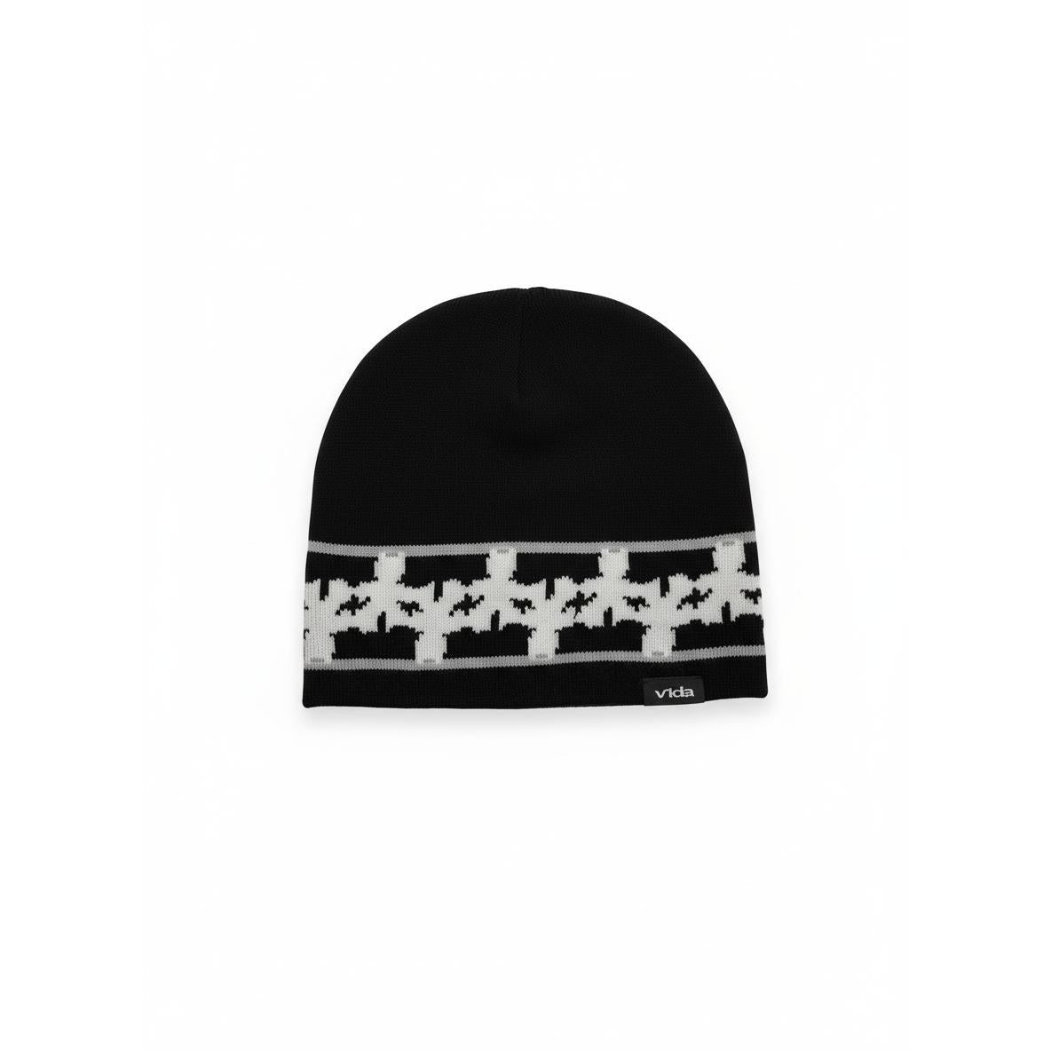 The V1da Pattern Beanie features a low fit in black, accented with a white houndstooth pattern band and a small "vida" label—your ideal go-to winter hat.