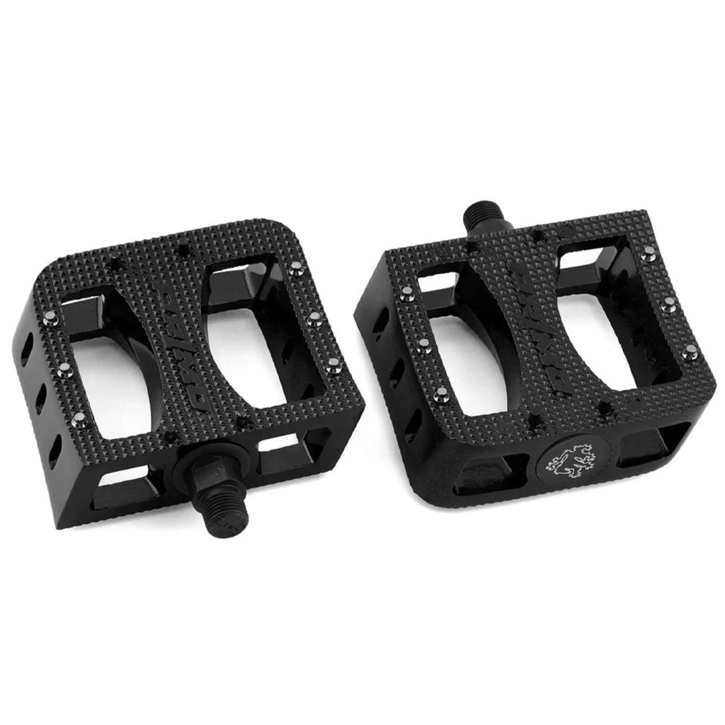 A pair of black, rectangular Primo Super Tenderizer Alloy Pedals with a textured aluminum body, chromoly spindle, and metal studs for a superior grip.