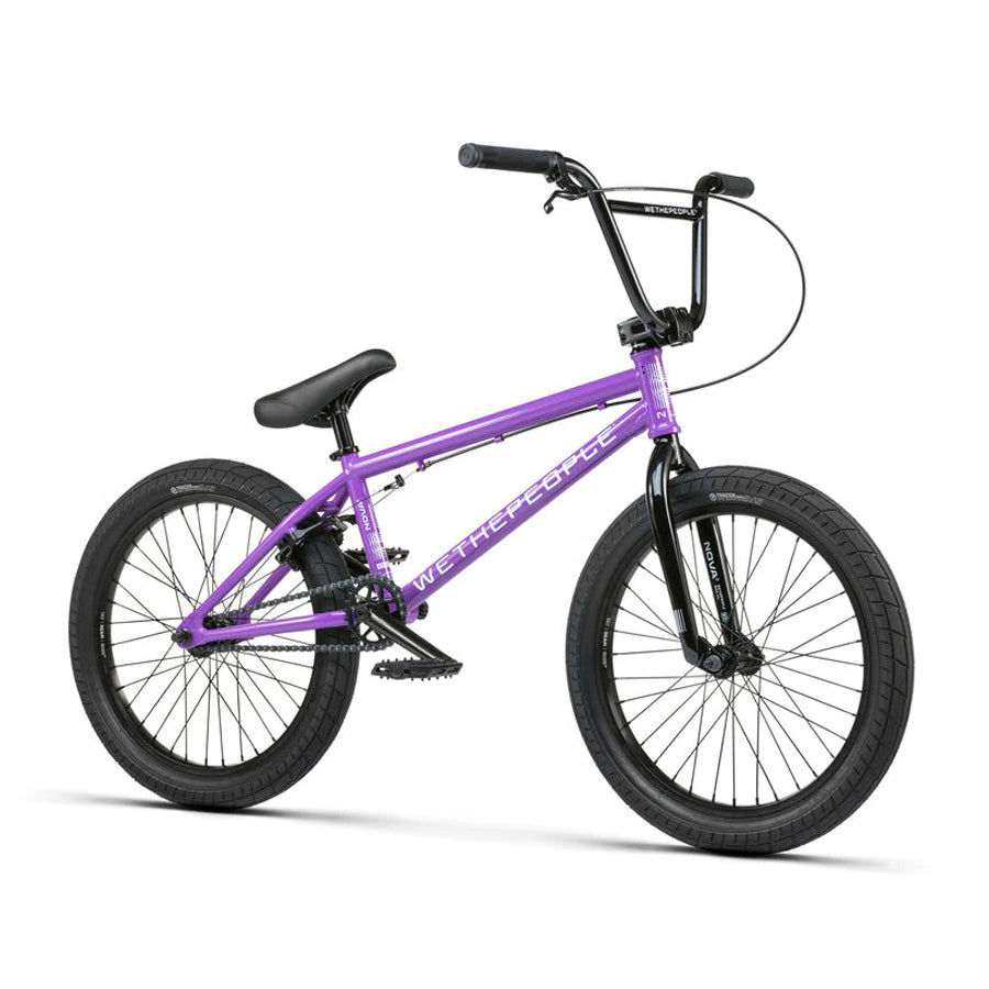 A purple Wethepeople Nova 20 Inch BMX bike against a white background.