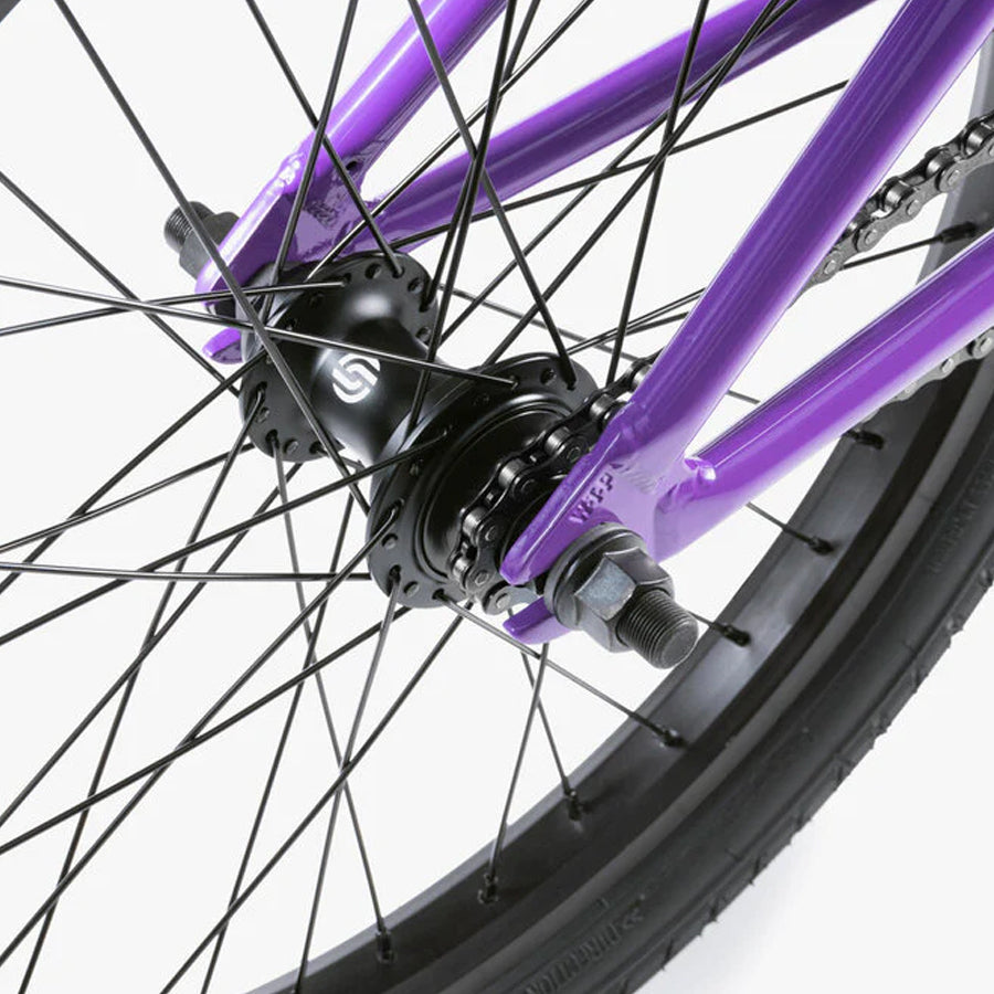 A close up of the Wethepeople Nova 20 Inch BMX Bike with black spokes.