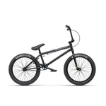 Description: The Radio Evol 20 Inch Bike, perfect for beginner riders, showcases "Radio Bike Co." branded tires, a padded seat, and straight handlebars. This black BMX bike is equipped with high-quality parts, a durable frame, and pegs on both the front and rear wheels.
